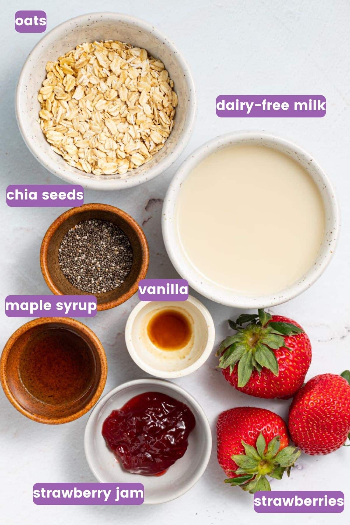 oats, dairy-free milk, chia seeds, maple syrup, vanilla, strawberry jam, strawberries. 