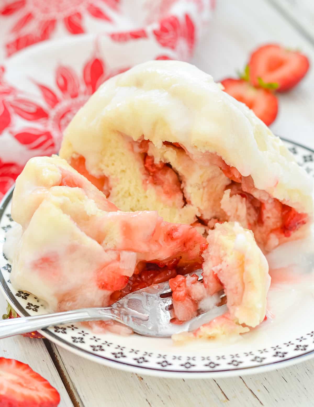 the inside of a strawberry sweet roll mug cake
