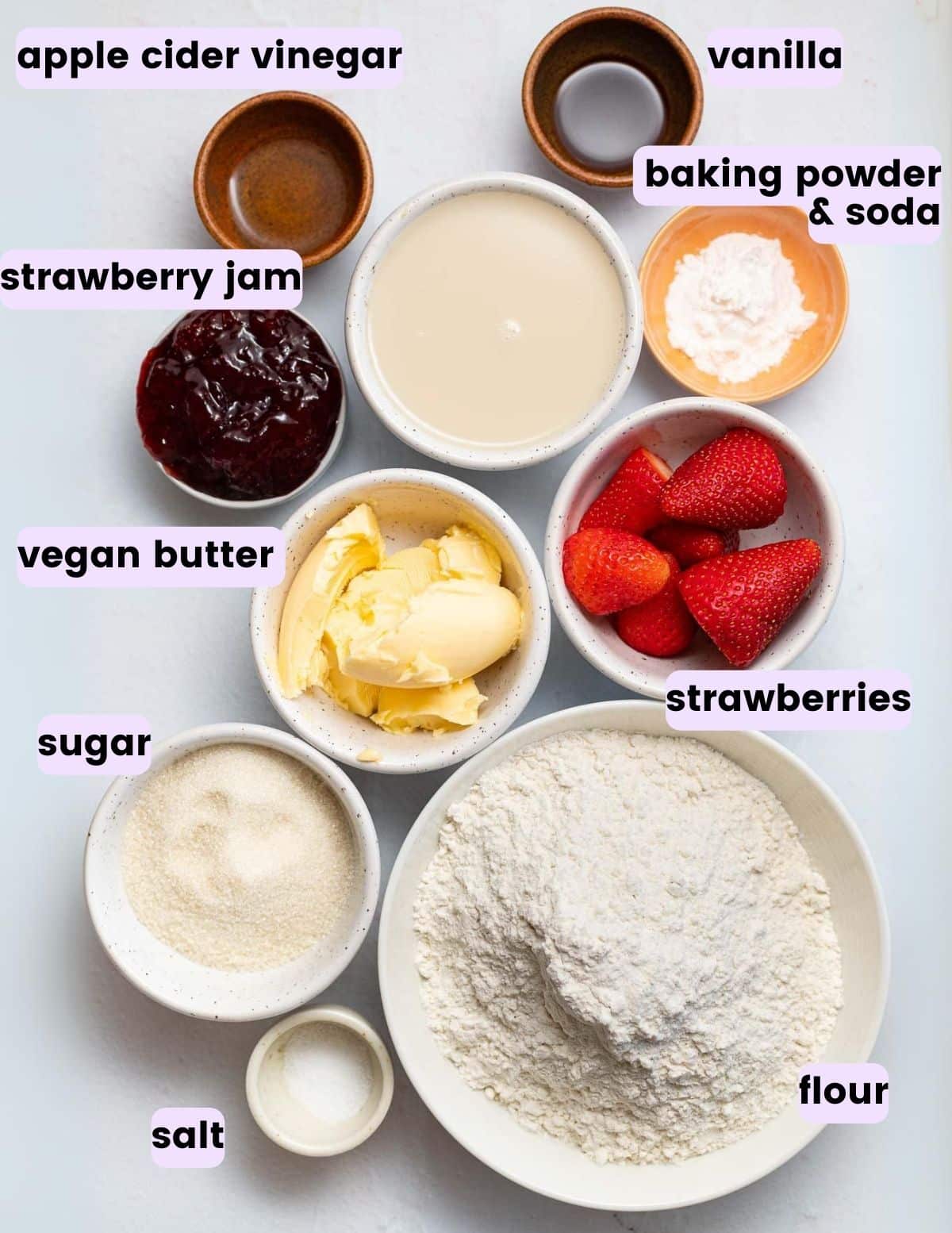apple cider vinegar, vanilla, strawberry jam, baking powder and soda, dairy-free milk, vegan butter, strawberries, sugar, flour, salt. 