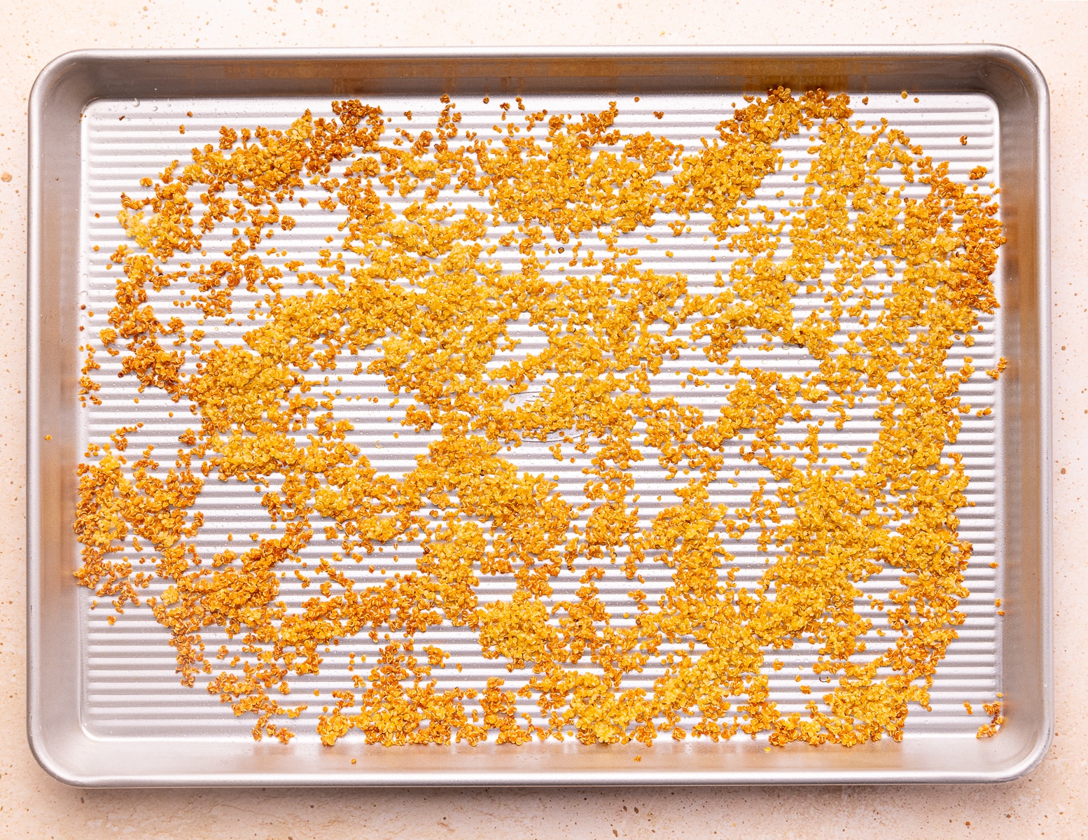 crispy golden quinoa on a baking tray