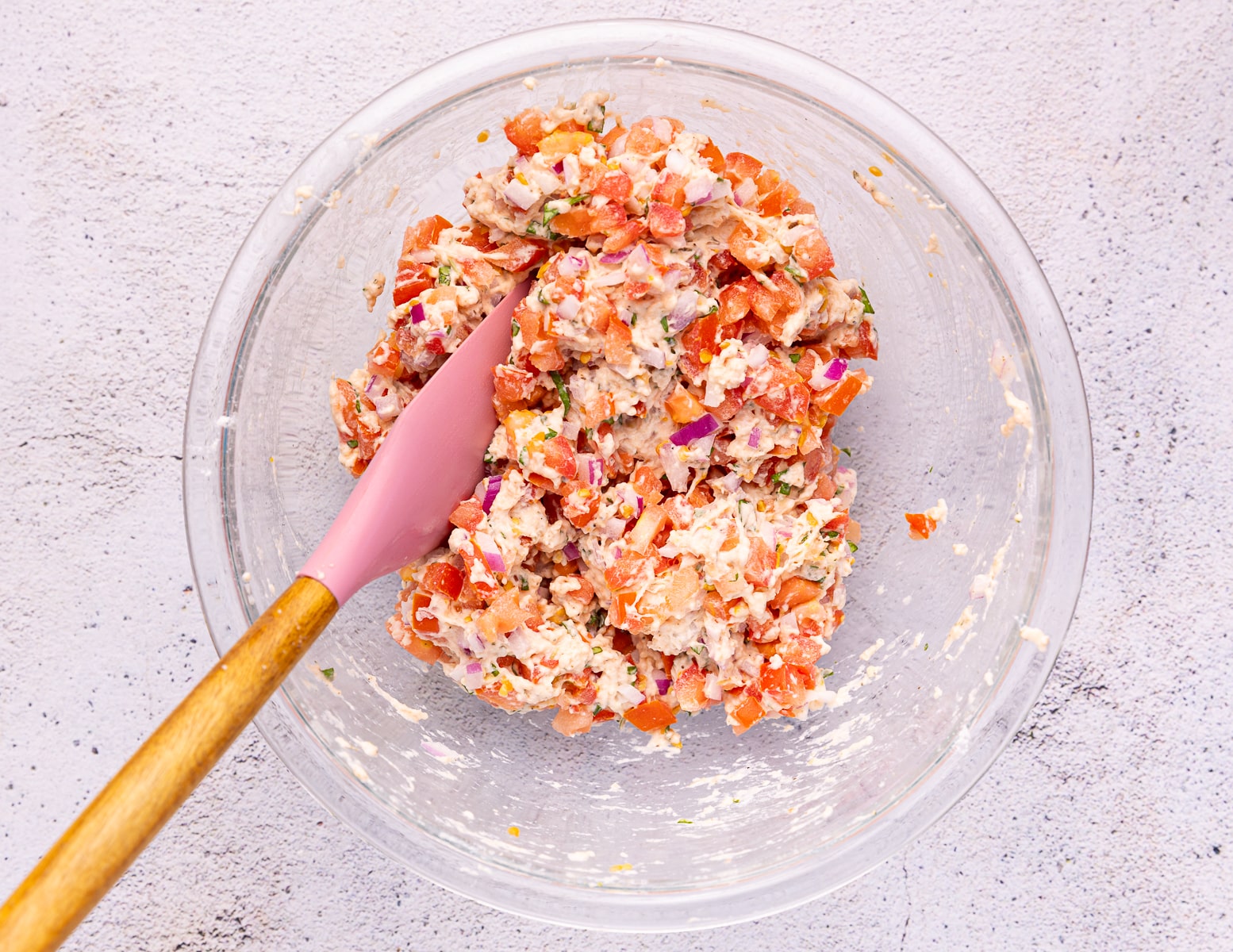 a bowl of tomato fritter batter