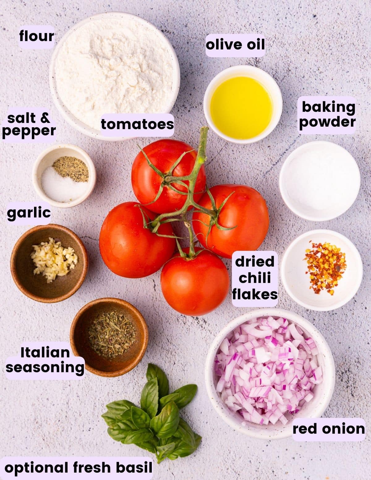 flour, olive oil, salt and pepper, tomatoes, baking powder, garlic, dried chili flakes, Italian seasoning, red onion and fresh basil. 