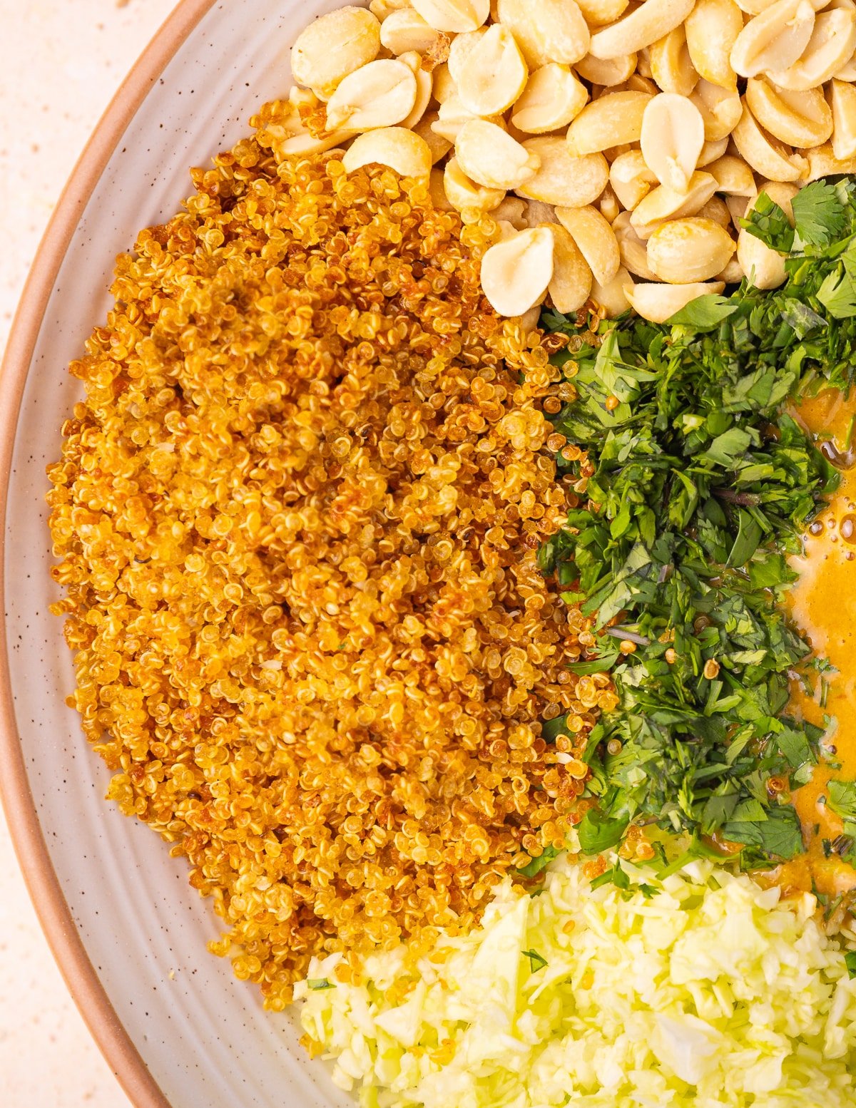 a salad bowl with a pile of quinoa crispies