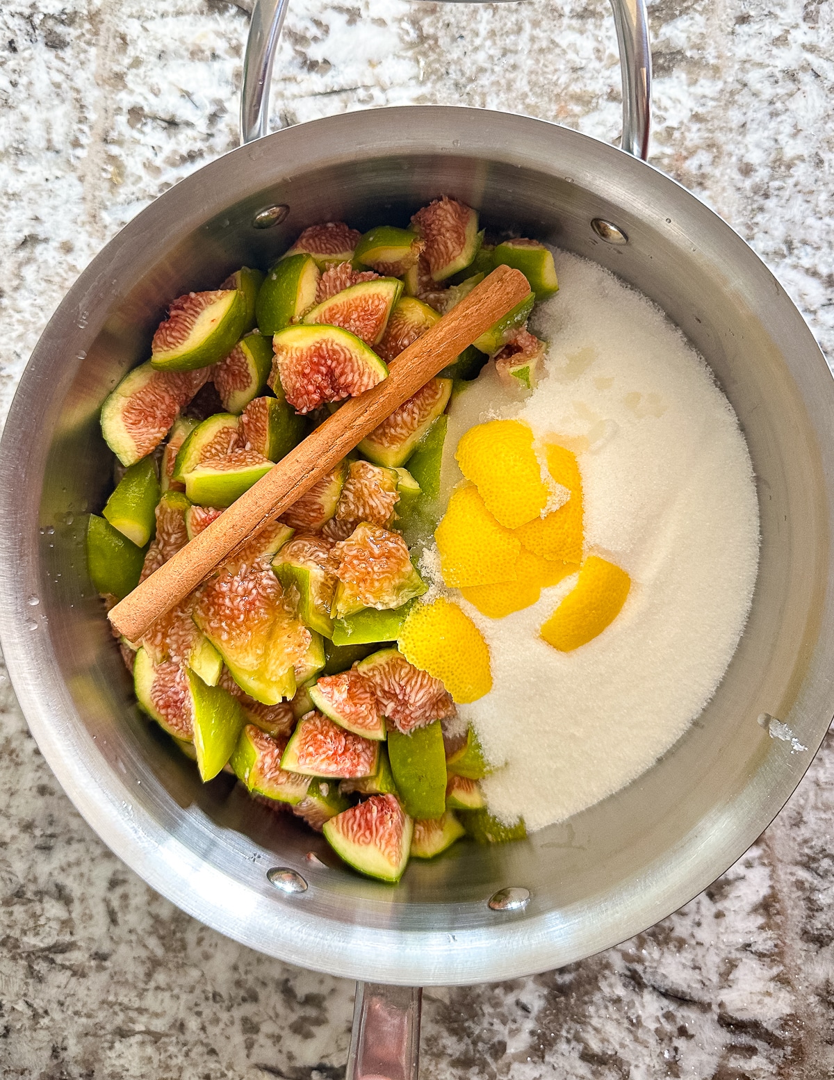 figs, sugar, lemon zest, lemon juice, and a cinnamon stick in a saucepan. 