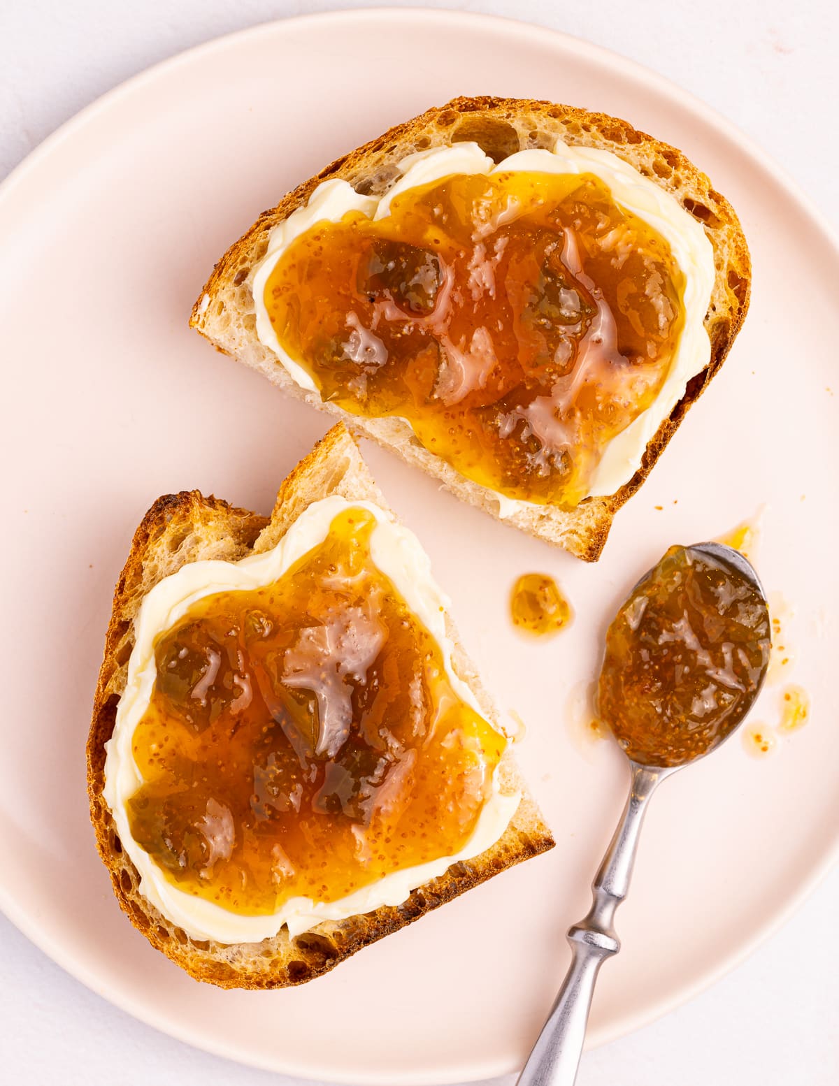 2 pieces of bread spread with vegan butter and fig jam