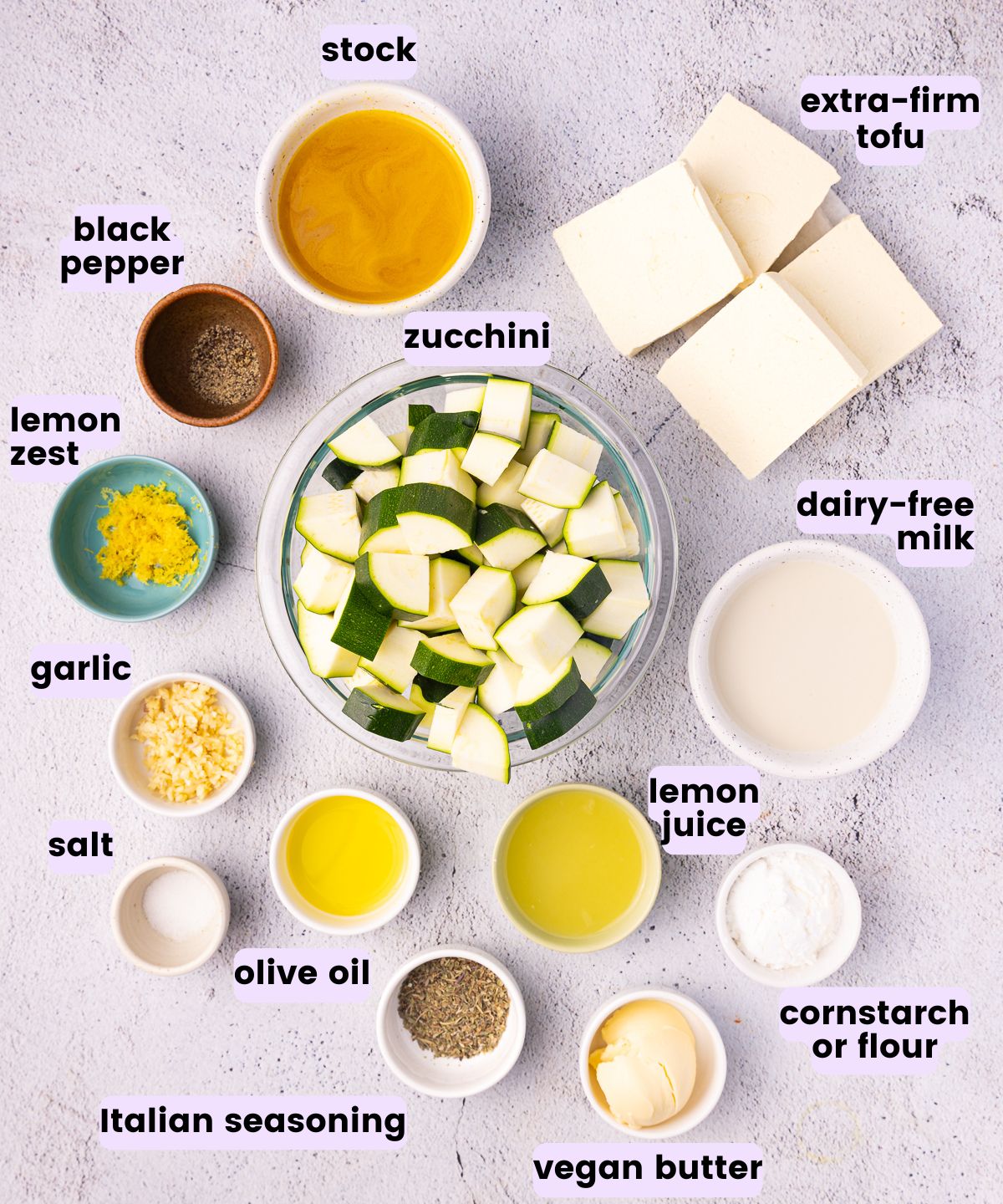 stock, tofu, black pepper, lemon zest, zucchini, dairy-free milk, garlic, salt, olive oil, lemon juice, Italian seasoning, cornstarch and vegan butter. 