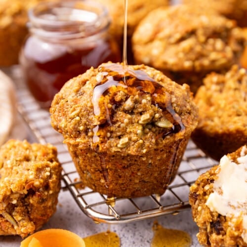 Vegan honey drizzling over the top of a delicious looking vegan morning glory muffin.