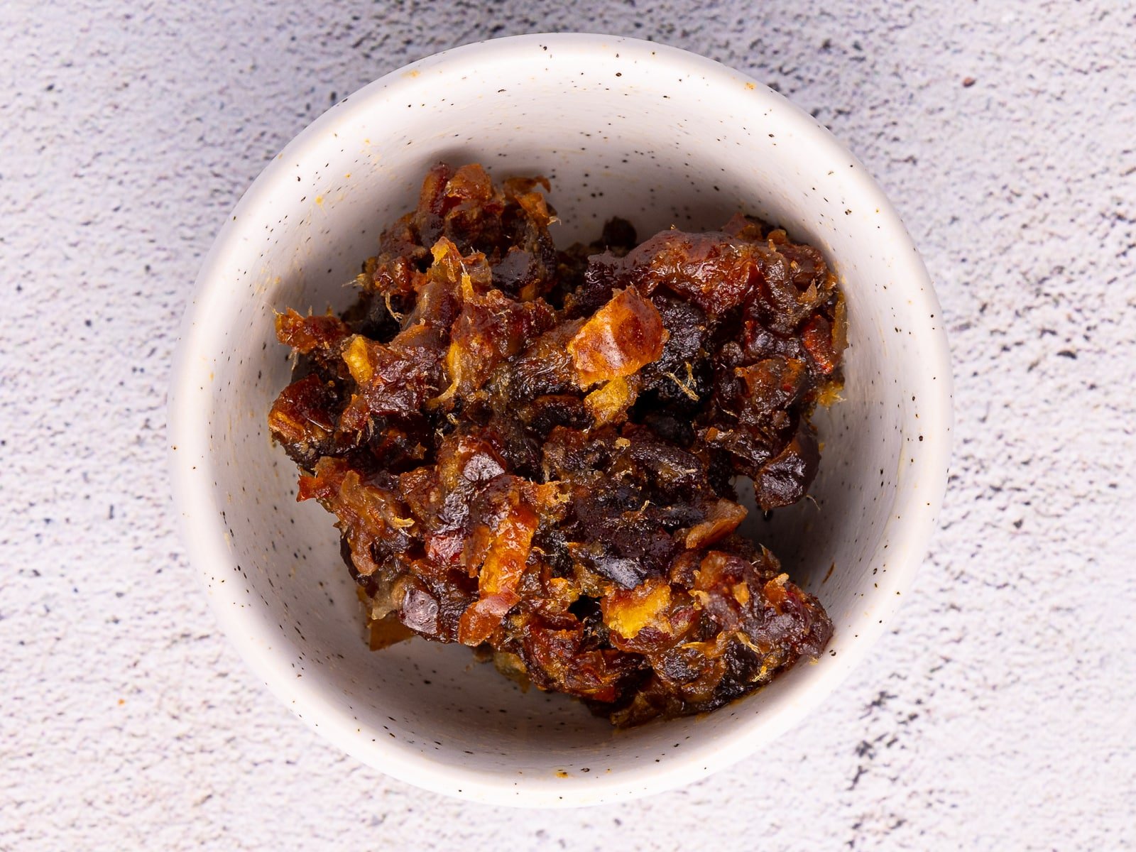 Chopped medjool dates in a bowl. 