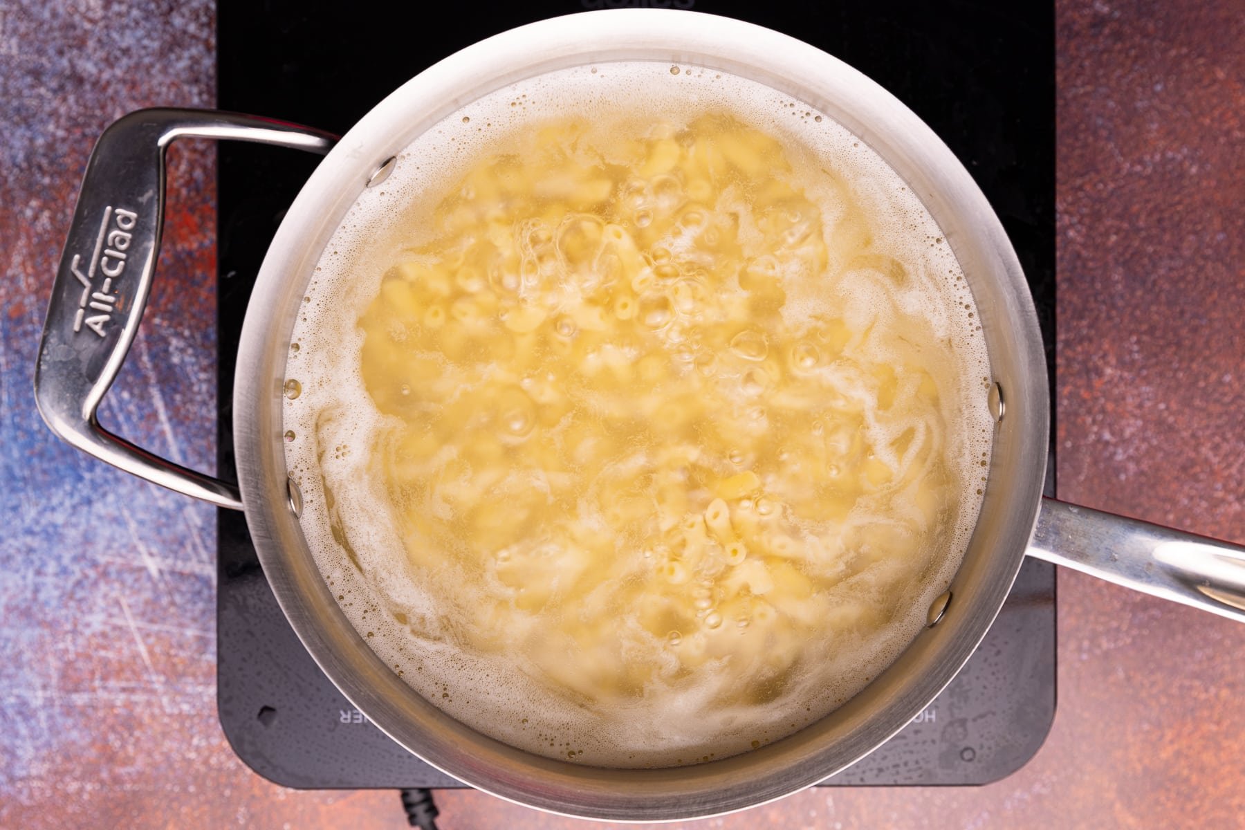 macaroni boiling in a saucepan of water