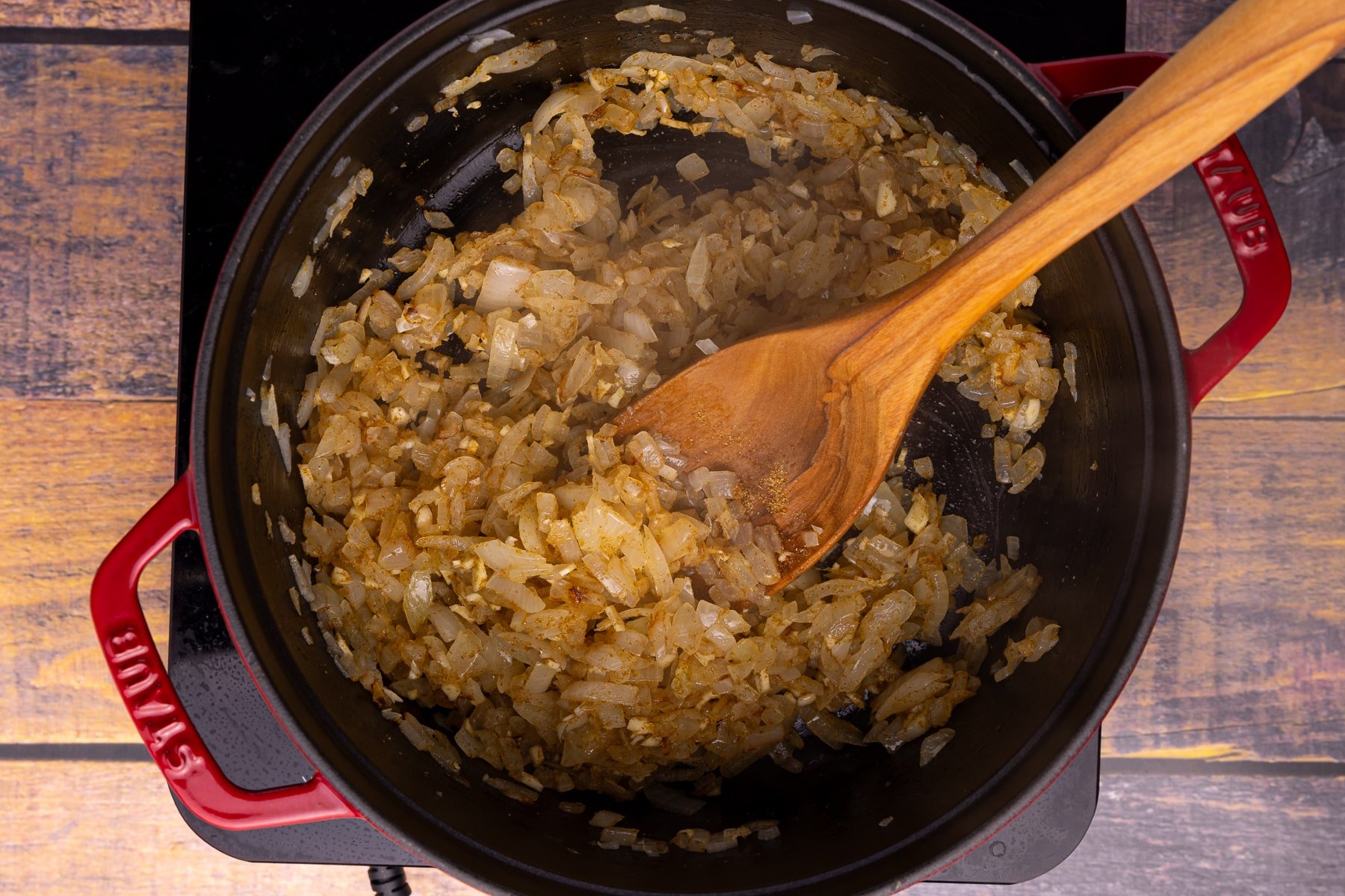 onions, garlic and spices sautéing in a Dutch oven