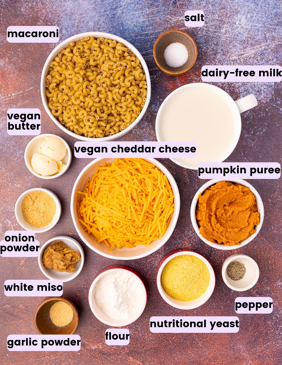 dried macaroni, salt, vegan butter, dairy-free milk, vegan cheddar cheese, onion powder, pumpkin puree, white miso, garlic powder, flour, nutritional yeast, black pepper. 