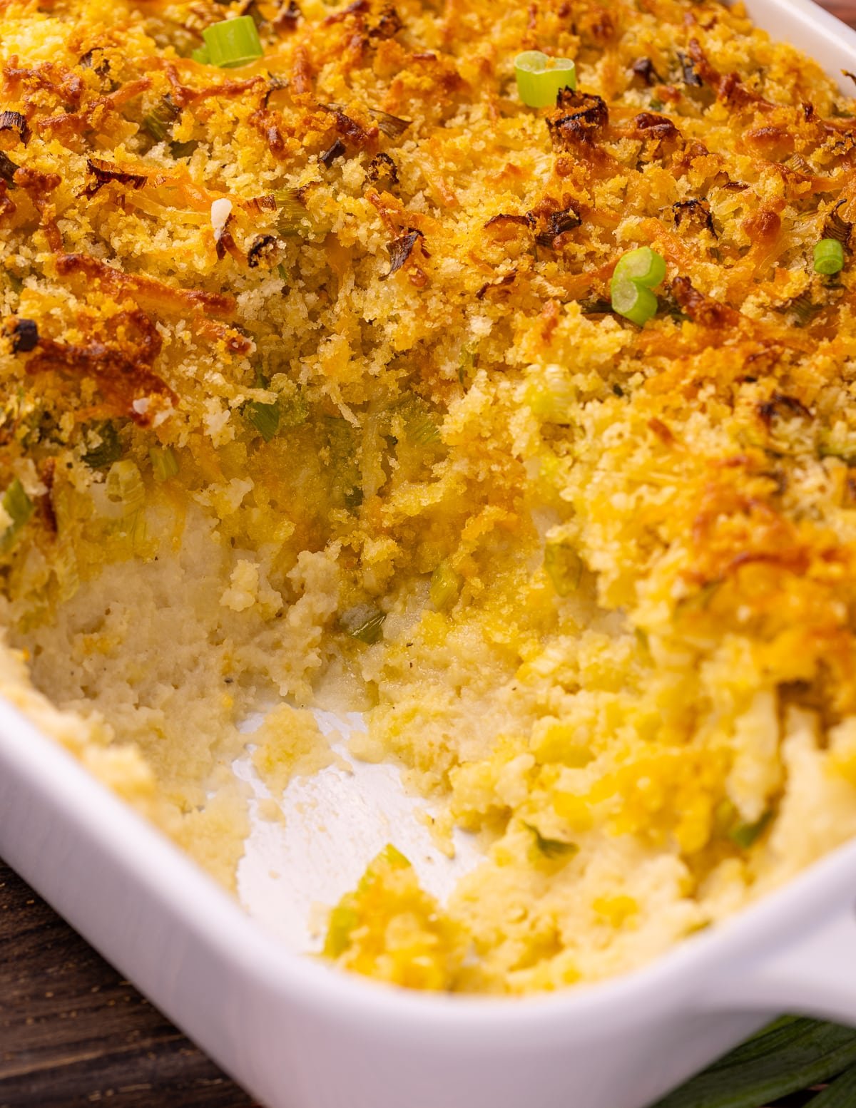 a close up photo of the inside of the vegan mashed potato casserole. 