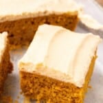 a slice of vegan pumpkin cake with brown sugar frosting