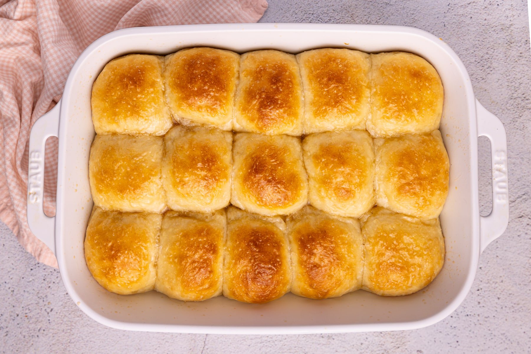 cooked dinner rolls in a ceramic dish