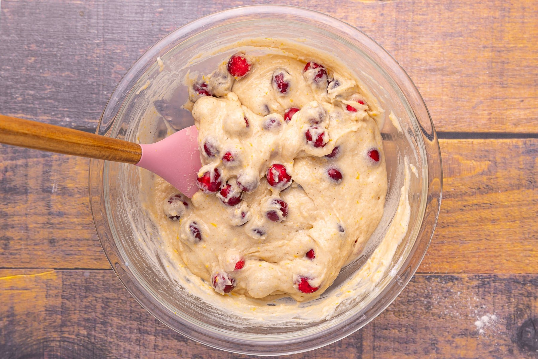 cranberry studded muffin batter in a bowl