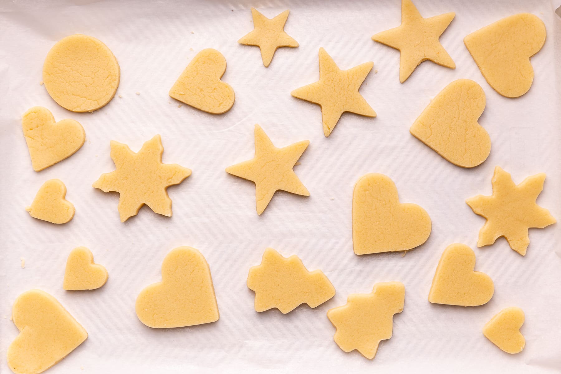 uncooked sugar cookies on a baking tray