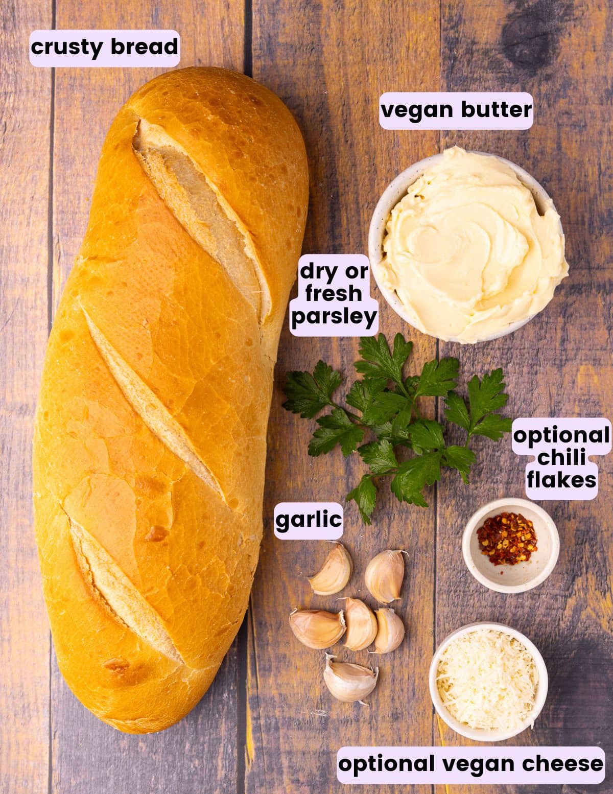 a loaf of bread, vegan butter, parsley, garlic, optional chili flakes, optional vegan cheese