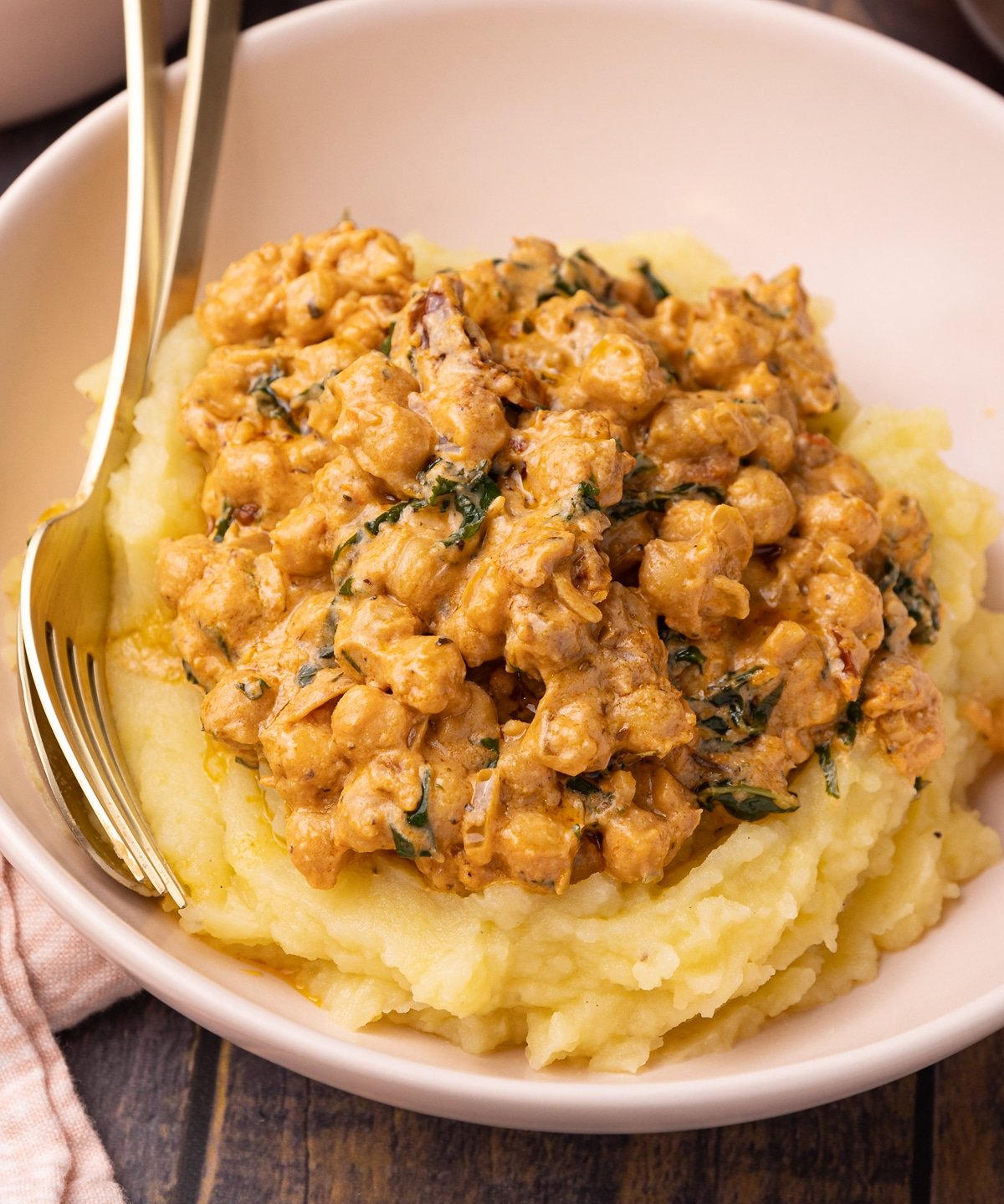 marry me chickpeas over mashed potatoes in a bowl