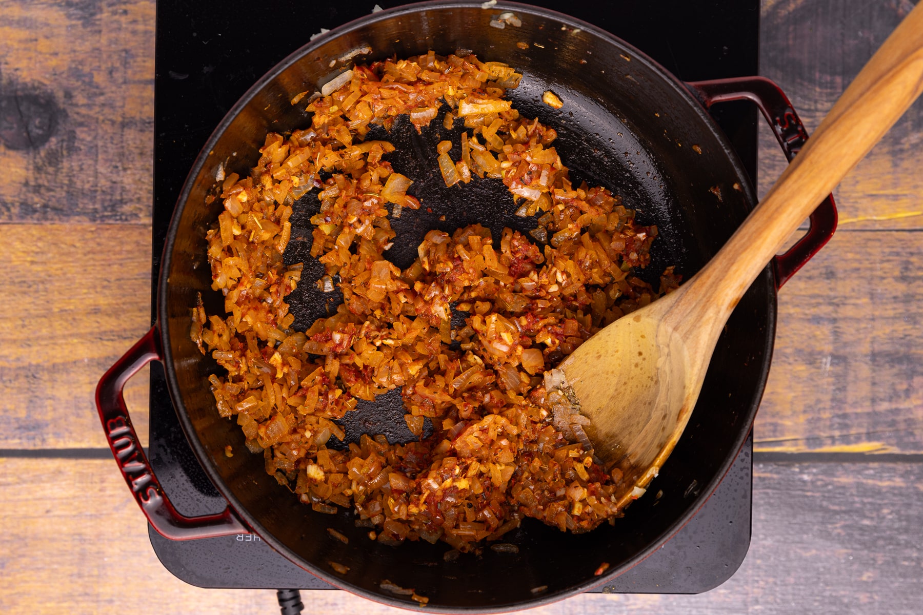 sautéed onions, garlic and tomato puree in a skillet