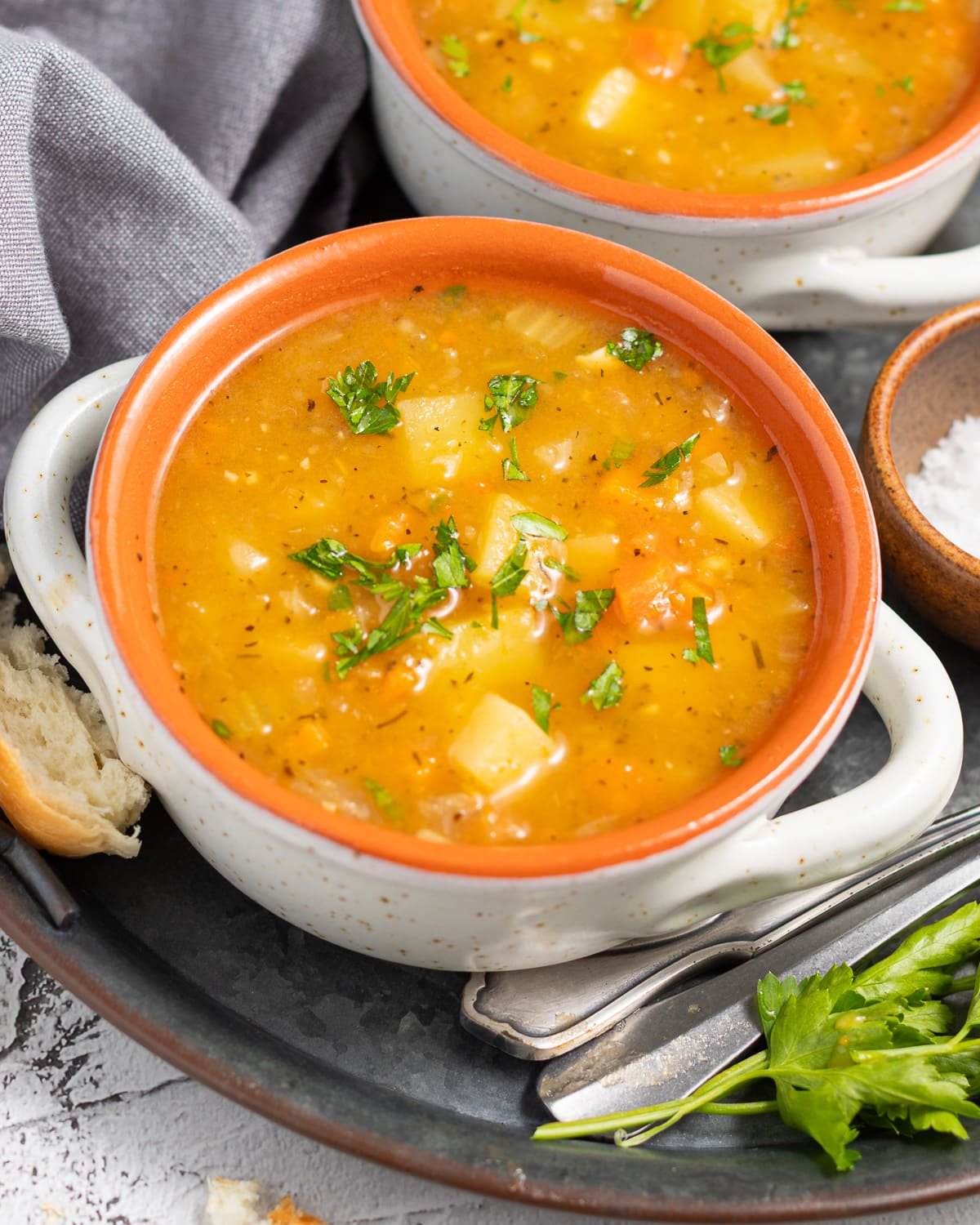 a bowl of Instant Pot Vegetable Soup with parsley garnish