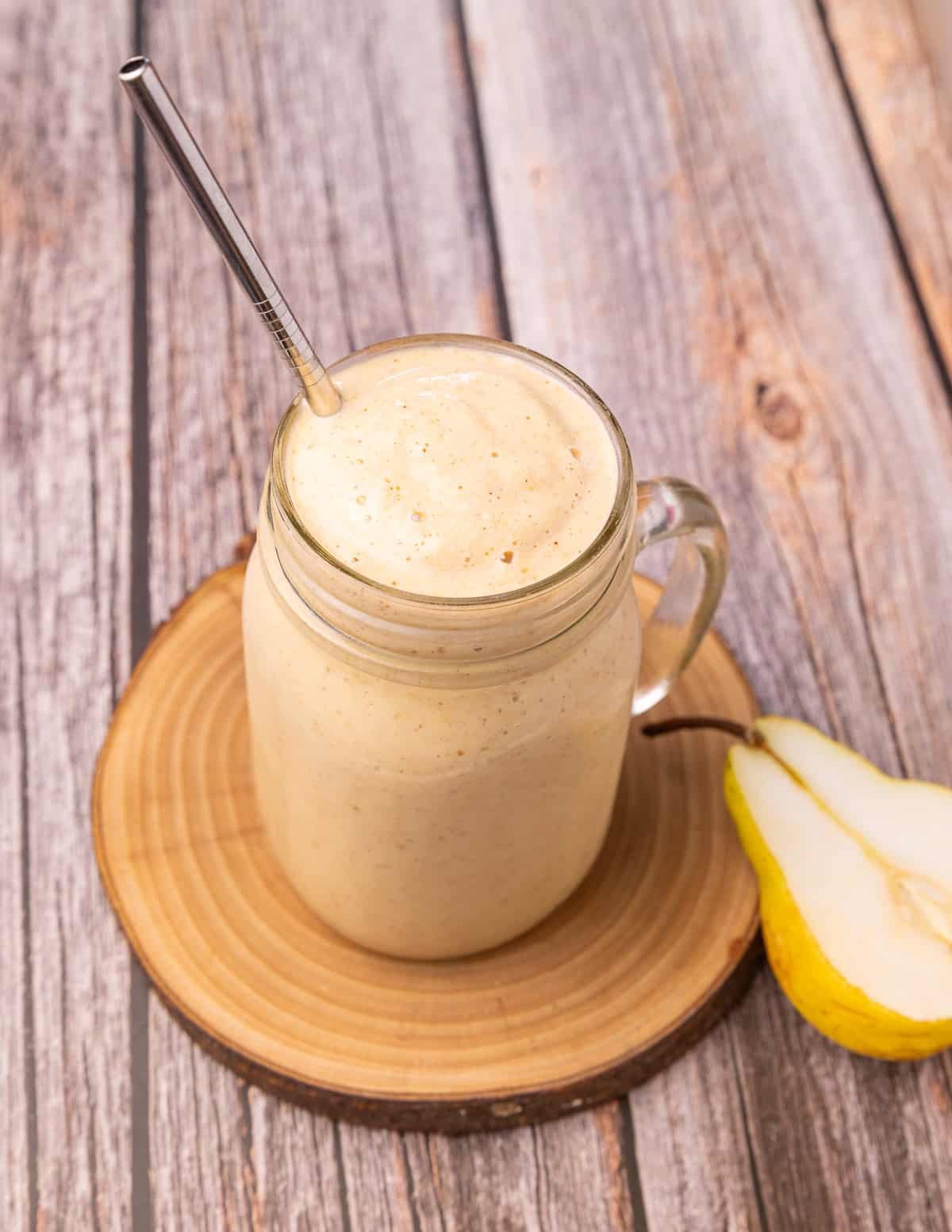 a pear smoothie with a straw
