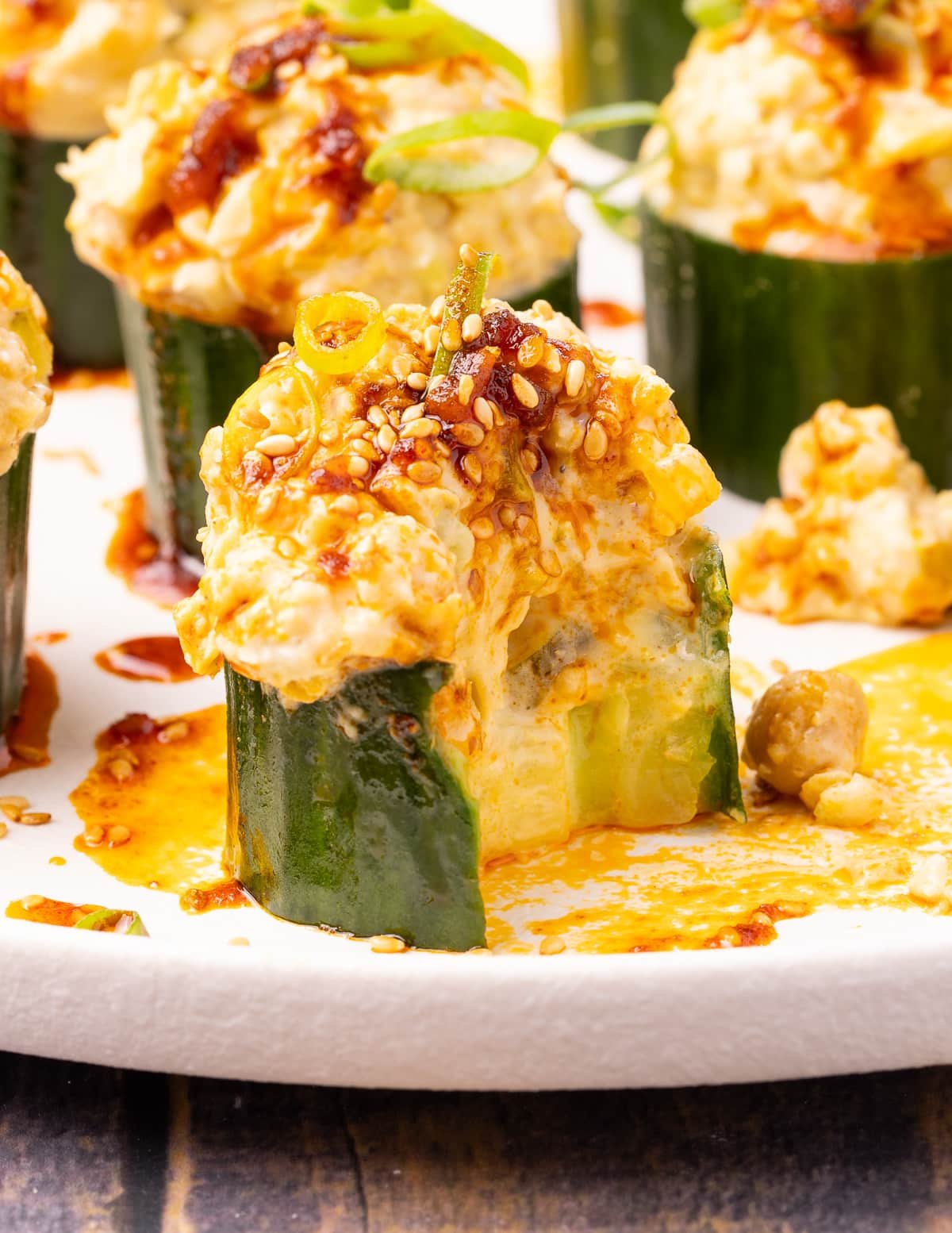 a part eaten stuffed cucumber cup