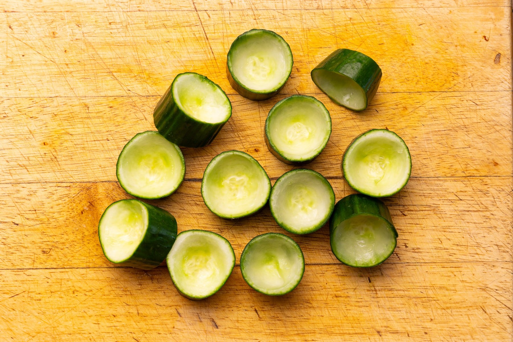 cucumber cups on a cutting board