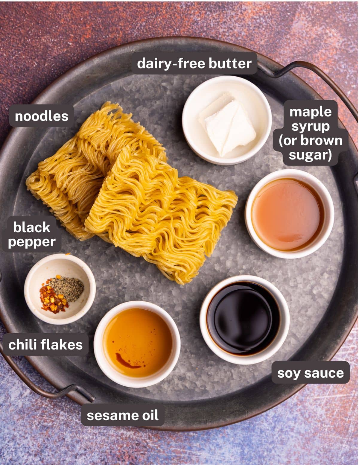 noodles, dairy-free butter, maple syrup, chili flakes, black pepper, sesame oil, soy sauce. 