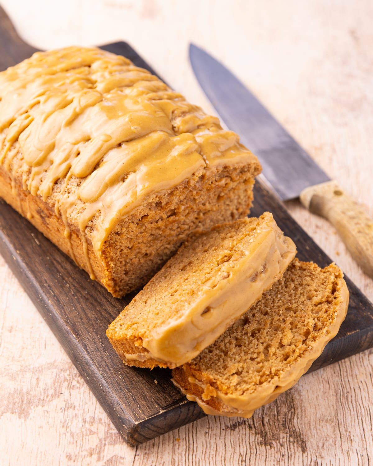 sliced applesauce cake on a wooden board