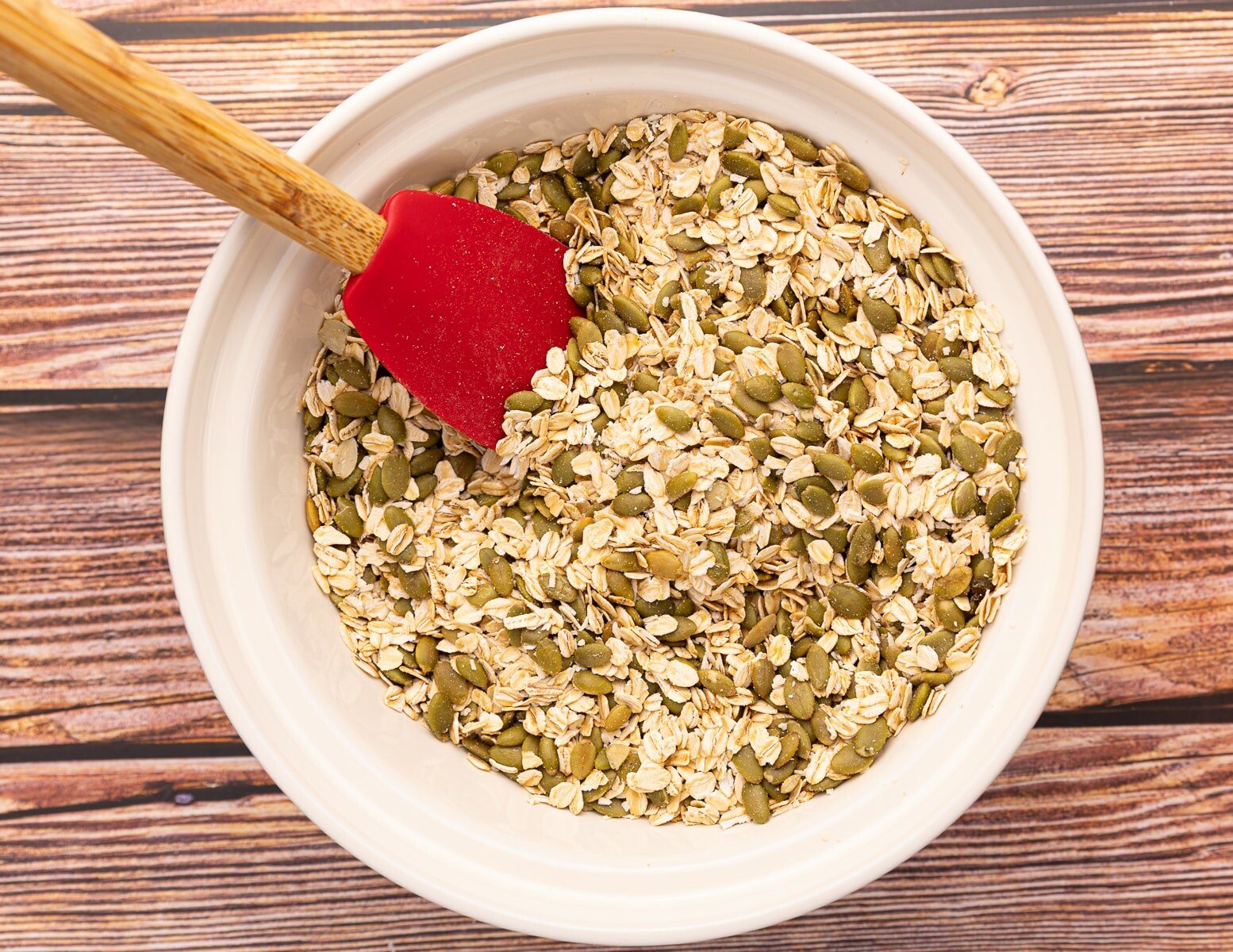 oats and pumpkin seeds in a bowl