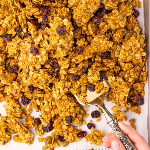 clumpy pumpkin seed granola on a baking tray