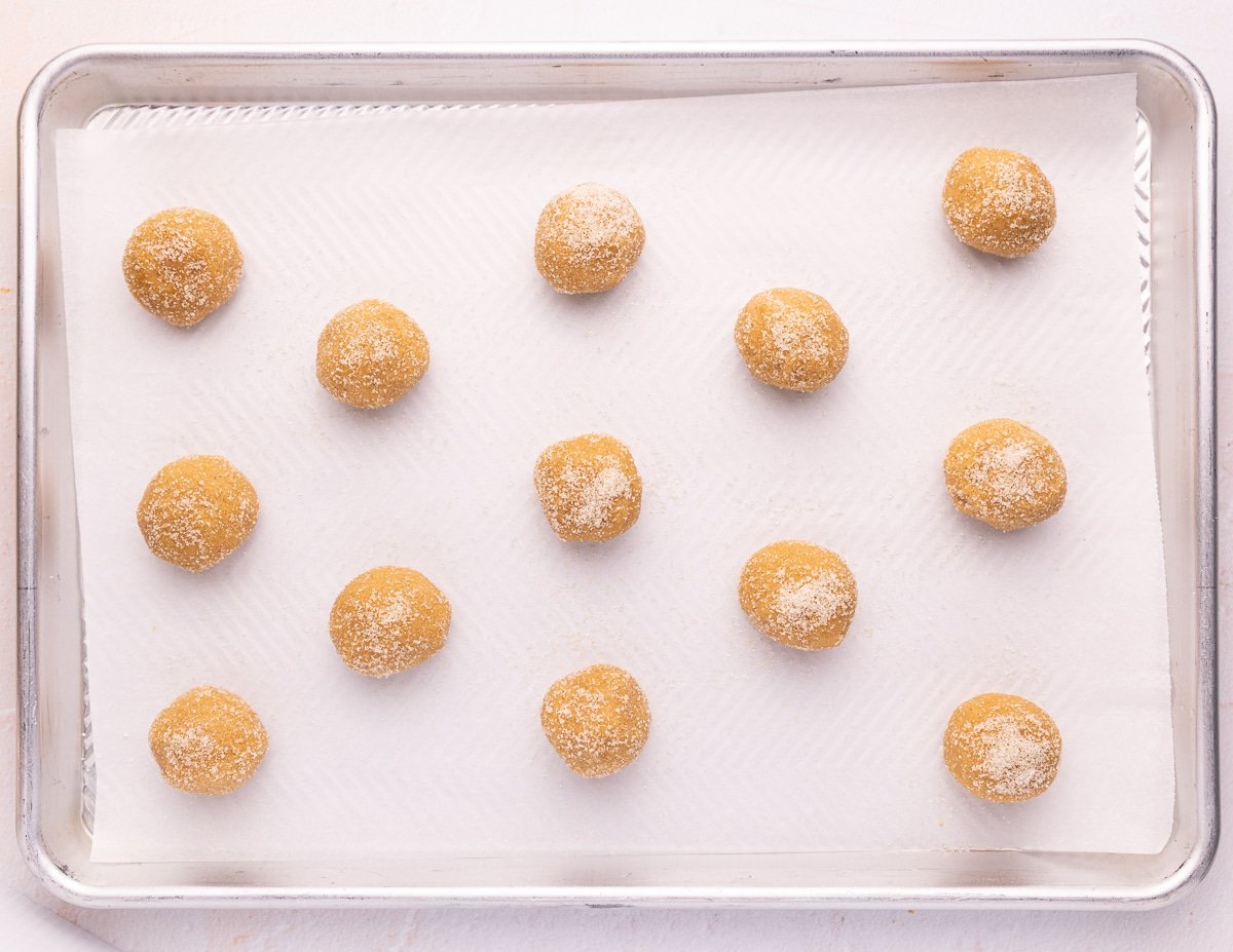 cookie dough balls on a baking tray 
