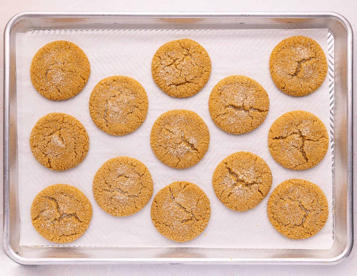 cooked gingersnap cookies on a baking tray