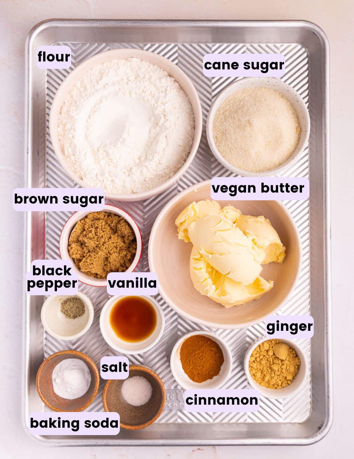 Vegan Gingersnap ingredinets - flour, cane sugar, brown sugar, vegan butter, black pepper, vanilla, ginger, cinnamon, baking soda, salt. 