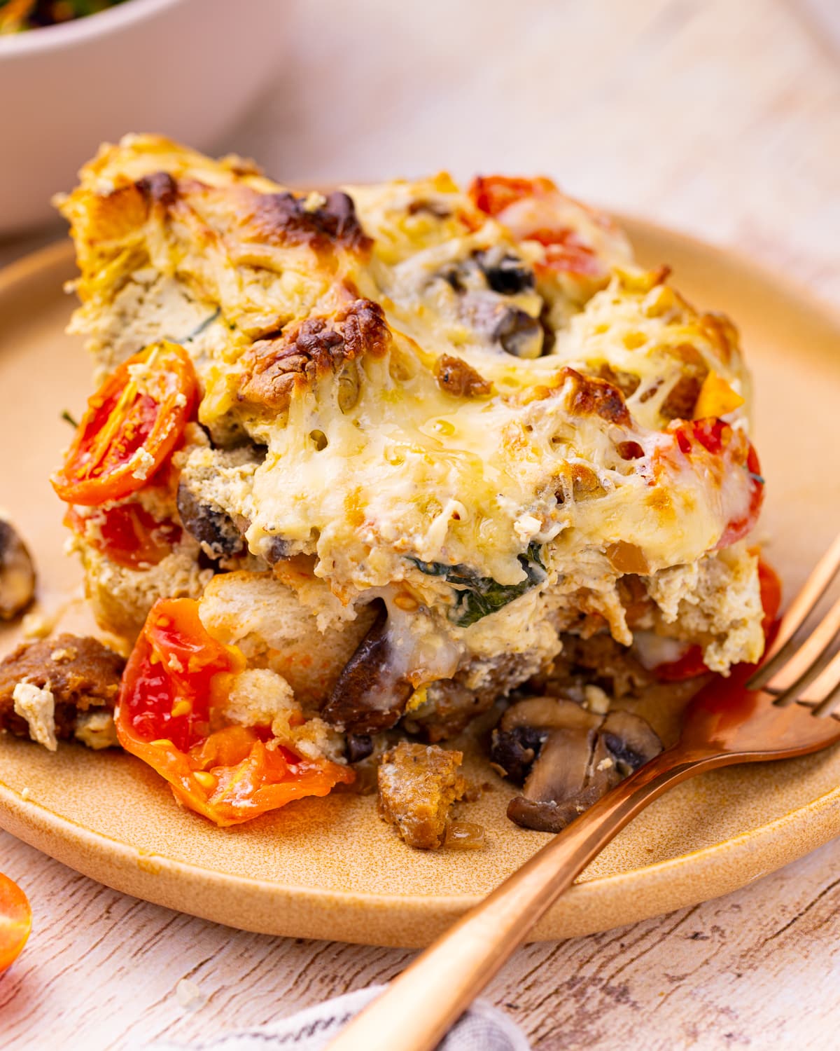 a slice of vegan strata on a plate