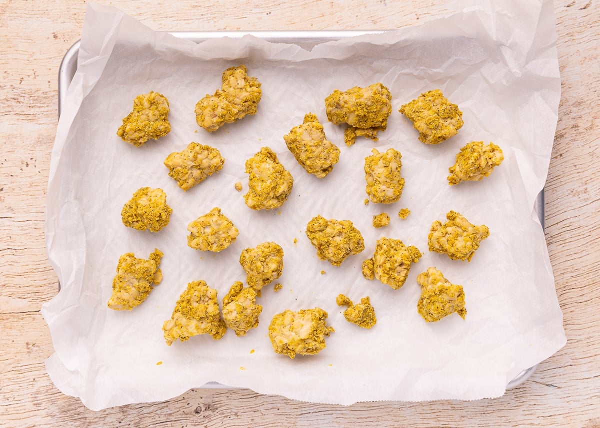 uncooked seasoned tempeh on a baking tray