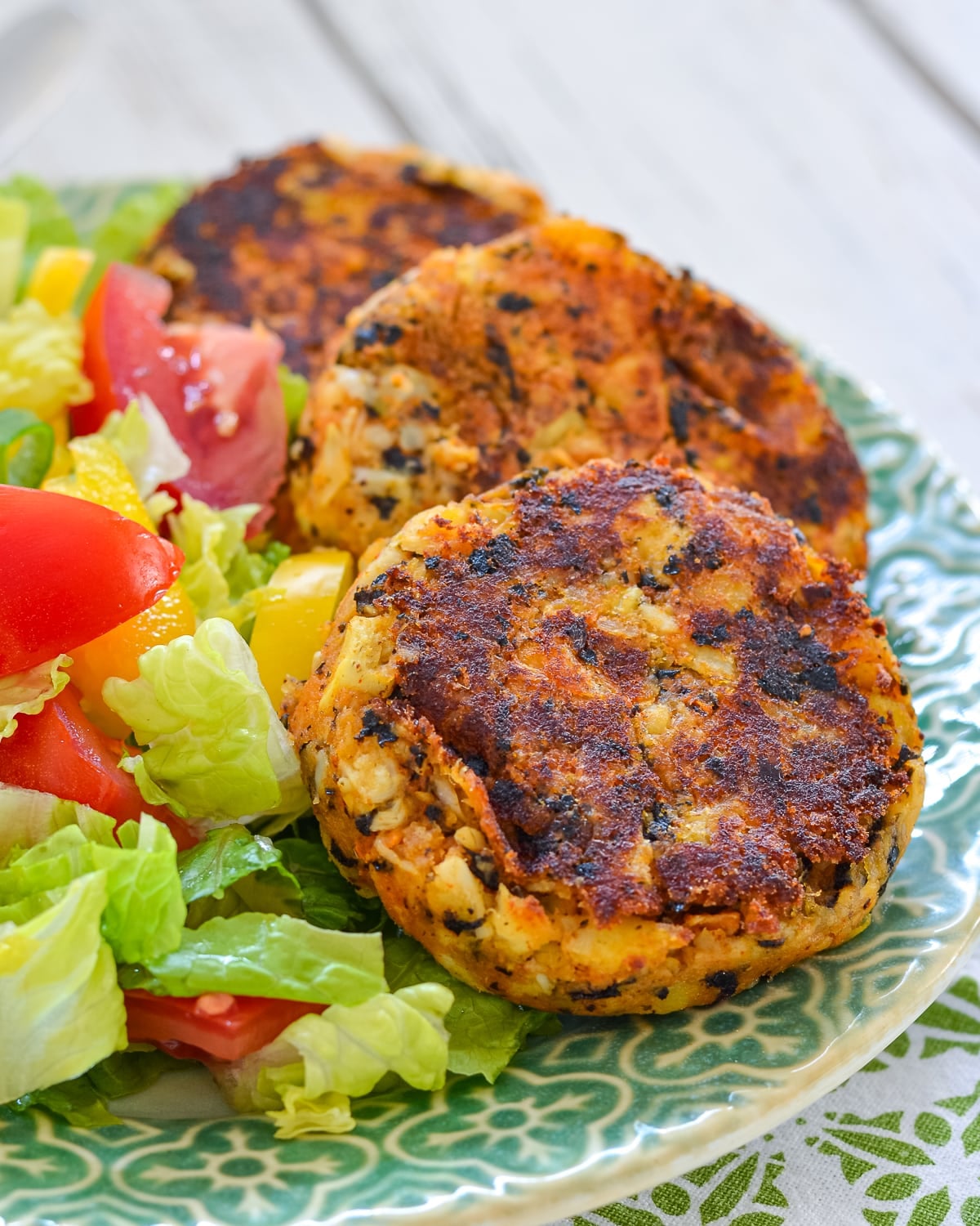 vegan crab cakes on a plate with salad