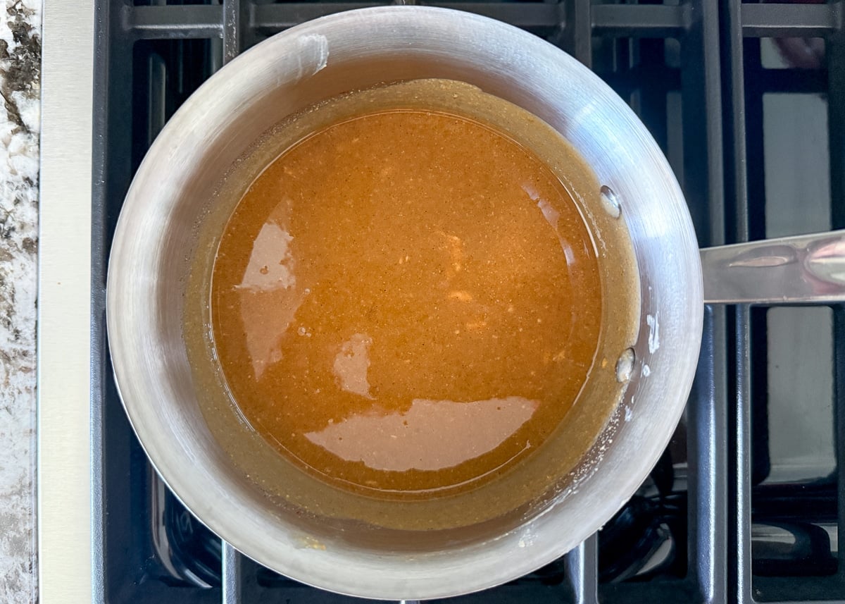 wet granola ingredients in a small pan