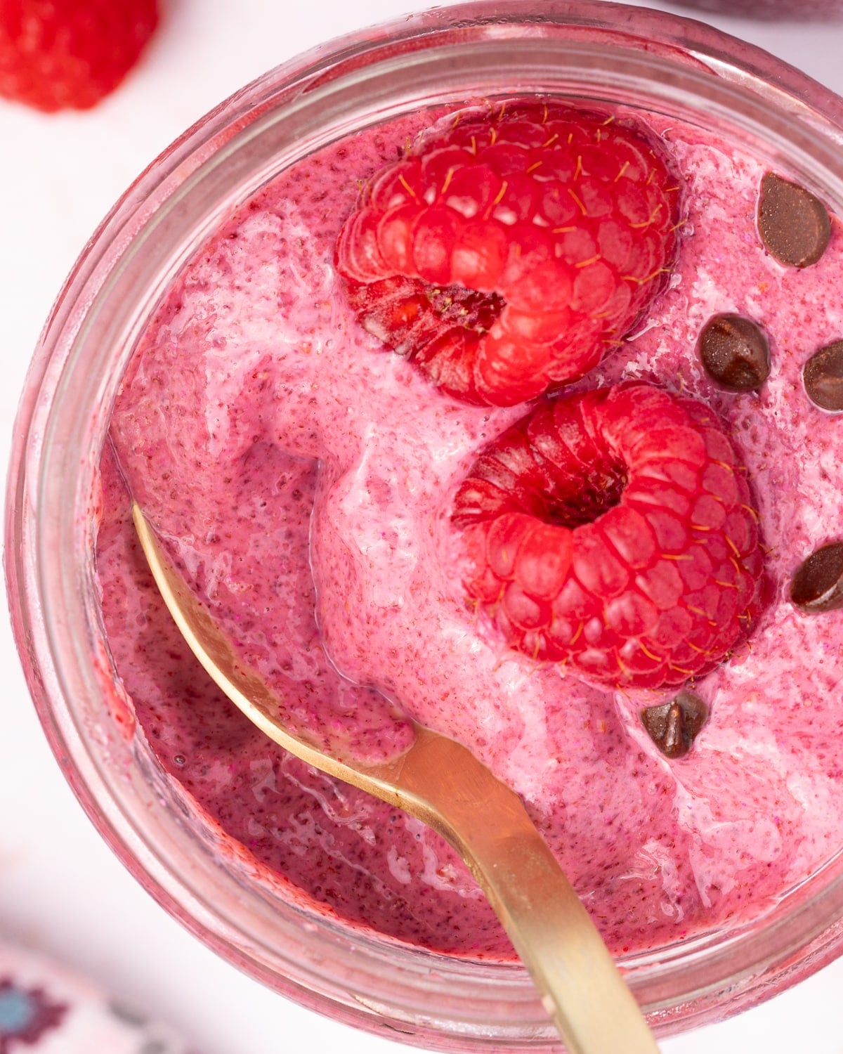 raspberry chia pudding with a spoon