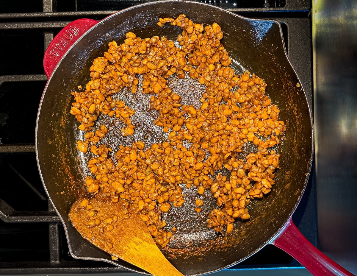 caramelized sticky crumbled tempeh in a skillet